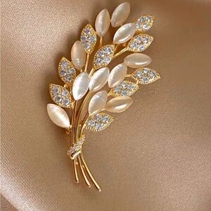 Golden flower brooch